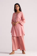 Woman wearing a Rose Tan Mul-Mul Co-ord Set with a plain background