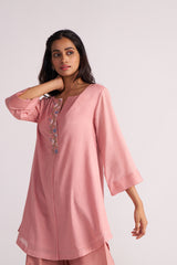 Woman wearing a Rose Tan Mul-Mul Co-ord Set with floral embroidery on a white background