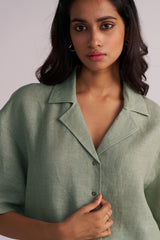 Woman wearing a Lily Pad Green Pure Linen Co-ord Set against a plain background
