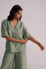 Woman wearing a Lily Pad Green Pure Linen Co-ord Set against a plain background