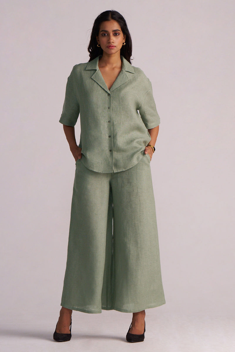 Woman wearing a Lily Pad Green Pure Linen Co-ord Set pants on a plain background