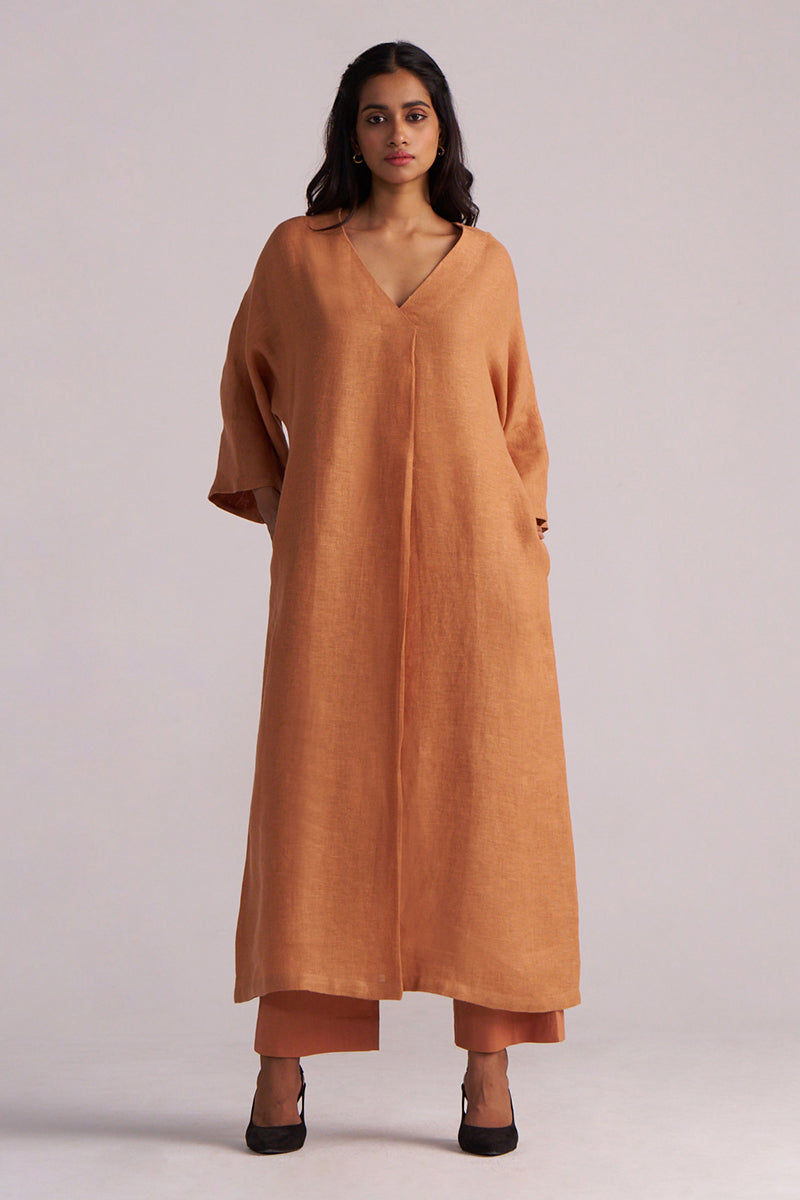 Woman wearing a Sunburn Pure Linen Co-ord Set a plain background