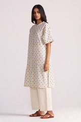 Woman wearing a Cream and Blue Small Flower Hand-Print Cotton Linen Co-ord Set on a light gray background
