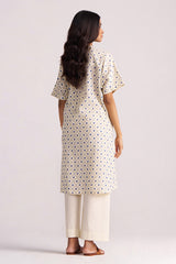 Woman wearing a Cream and Blue Small Flower Hand-Print Cotton Linen Co-ord Set on a plain background