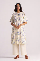 Woman wearing a Cream and Blue Small Flower Hand-Print Cotton Linen Co-ord Set on a plain background