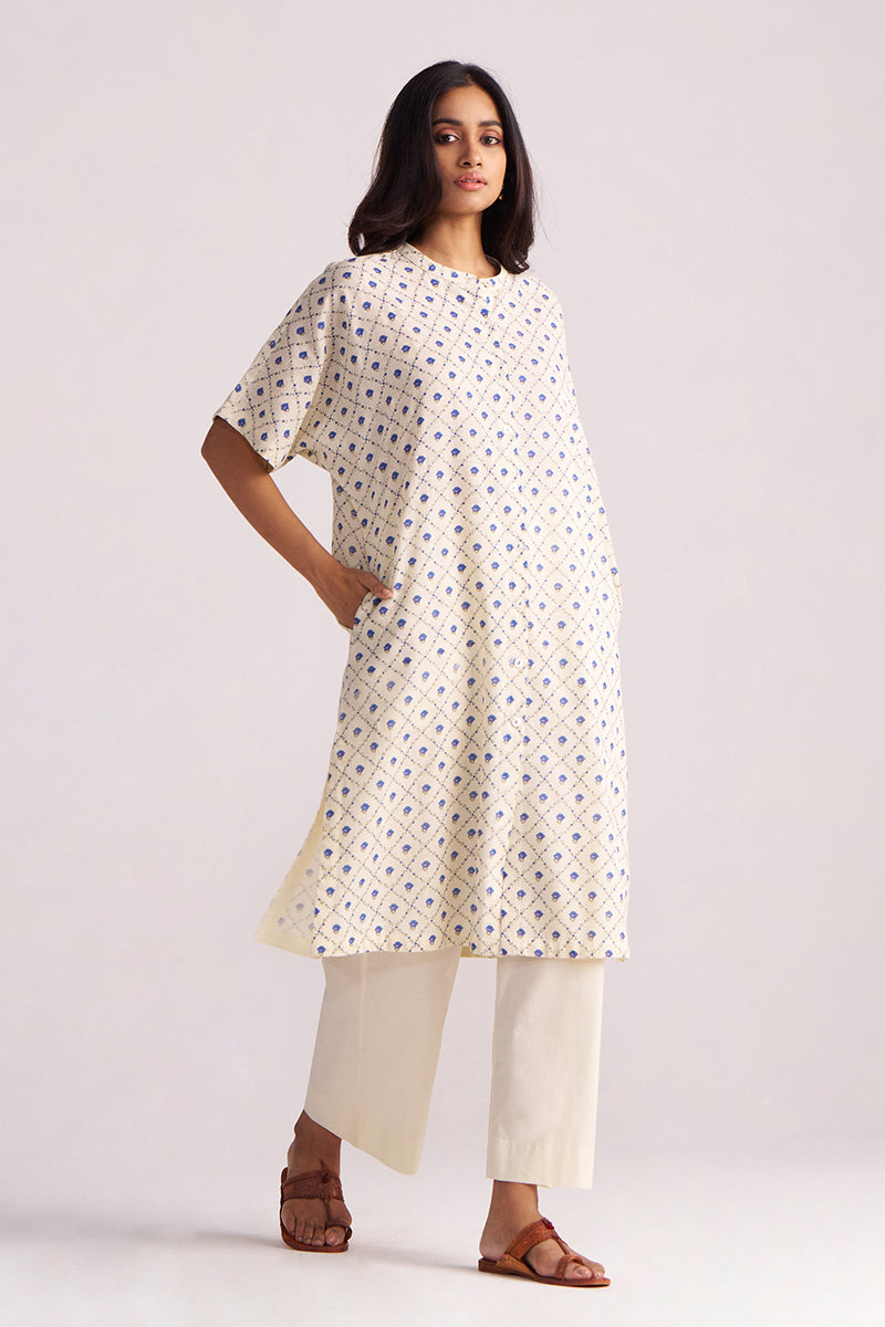 Woman wearing a Cream and Blue Small Flower Hand-Print Cotton Linen Co-ord Set on a plain background