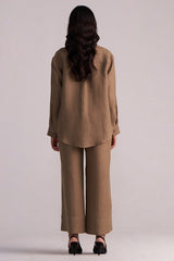 Woman wearing a Woodsmoke Brown Pure Linen Co-ord Set pants on a plain background