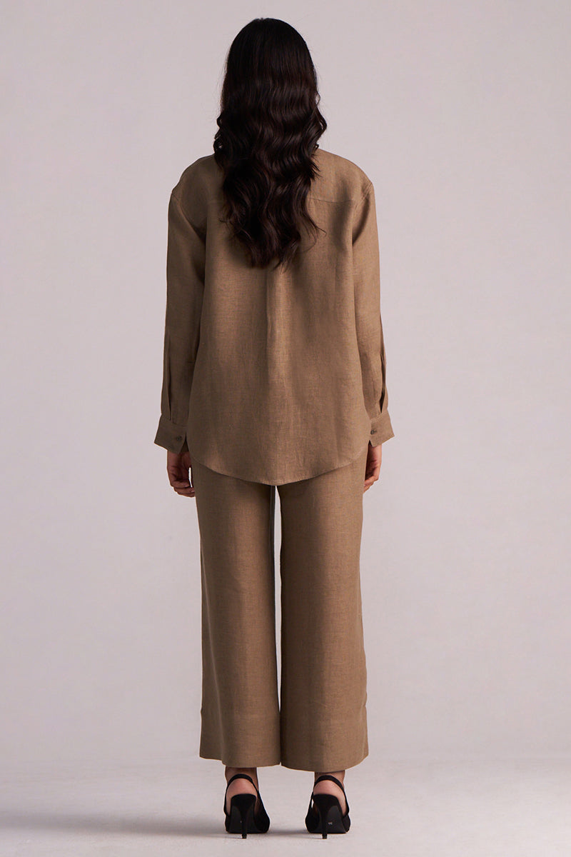 Woman wearing a Woodsmoke Brown Pure Linen Co-ord Set pants on a plain background