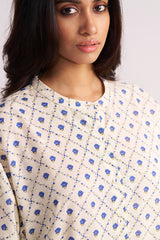 Woman wearing a Cream and Blue Small Flower Hand-Print Cotton Linen Co-ord Set against a plain background