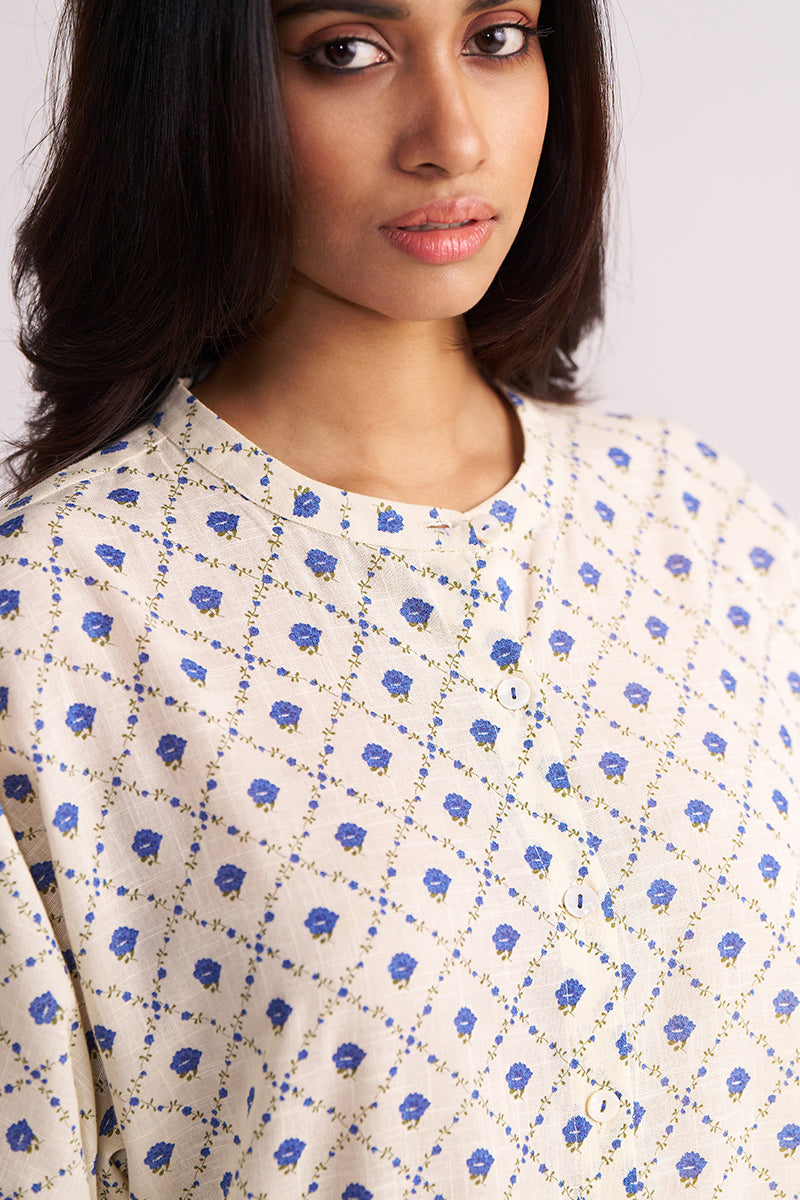 Woman wearing a Cream and Blue Small Flower Hand-Print Cotton Linen Co-ord Set against a plain background