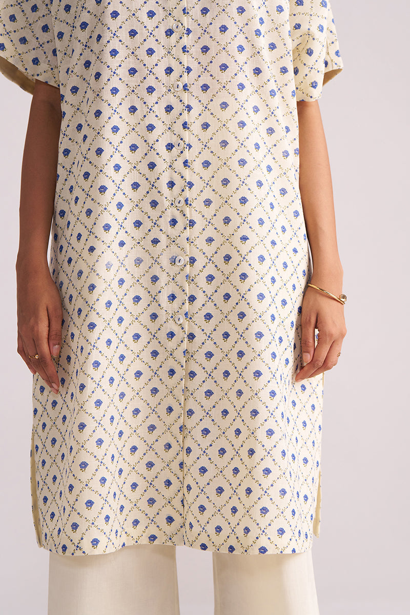 Cream and Blue Small Flower Hand-Print Cotton Linen Co-ord Set worn by a person on a light gray background